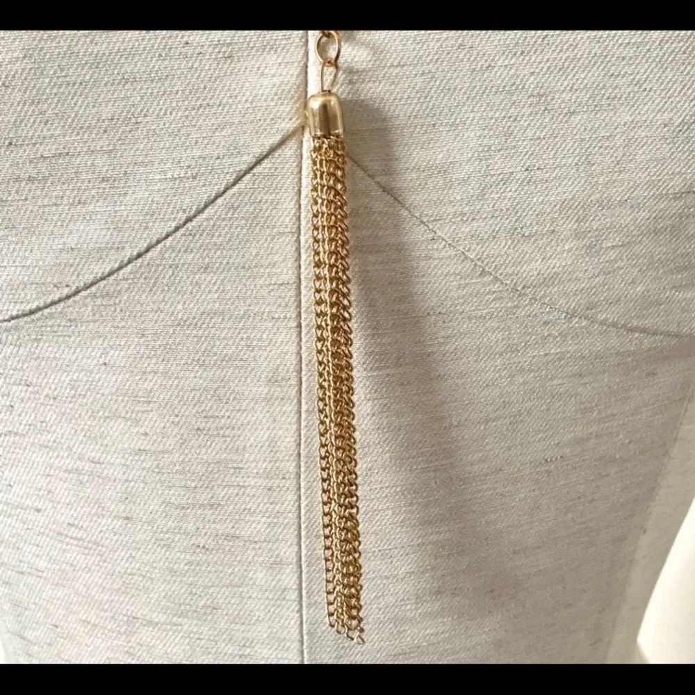 Gold tone long tassel necklace